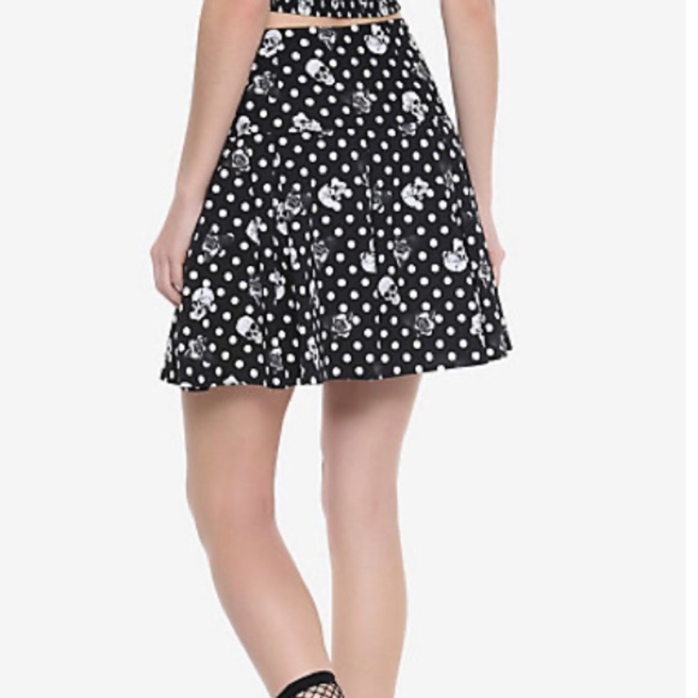 Polka dot and skull pleated skirt